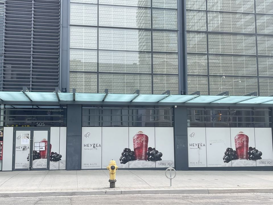 HEYTEA storefront with the opening soon sign