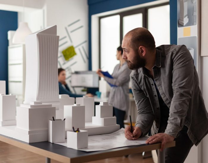 man-working-architectural-design-office_482257-8108